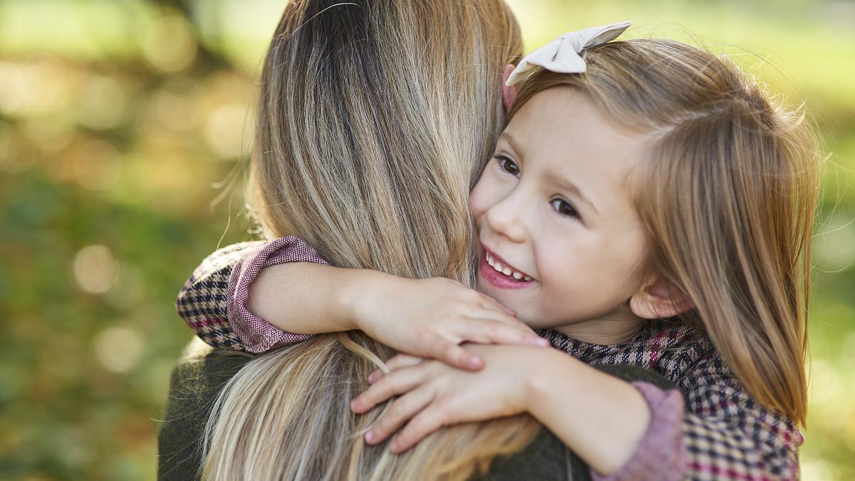 close-up-happy-girl-embracing-her-mommy_89263800