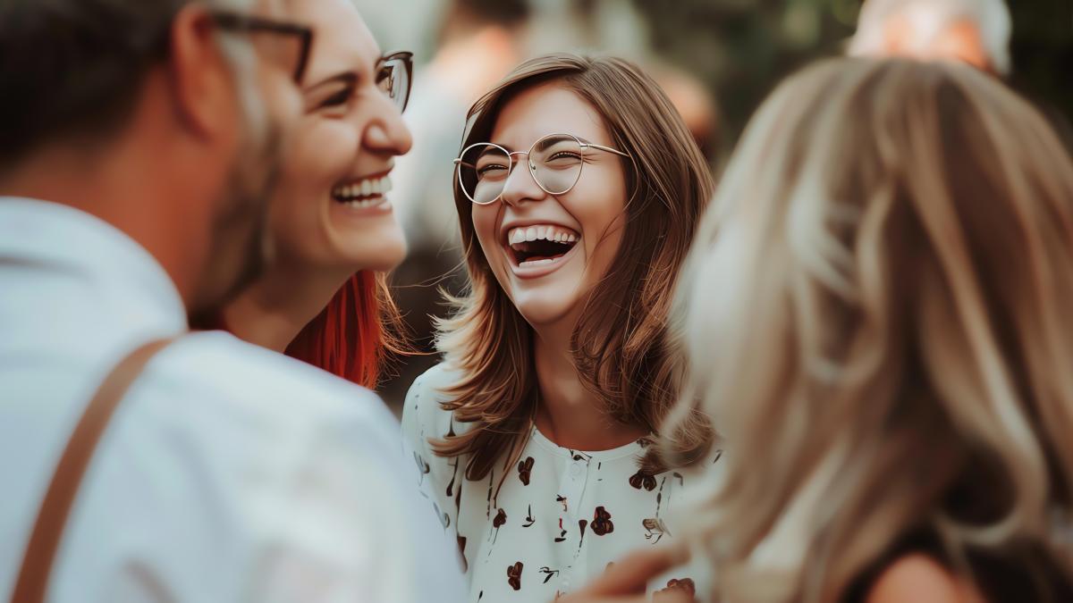 friends-laughing-having-good-time-party-focus-is-young-woman-with-glasses-who-is-laughing-looking-camera_66662200