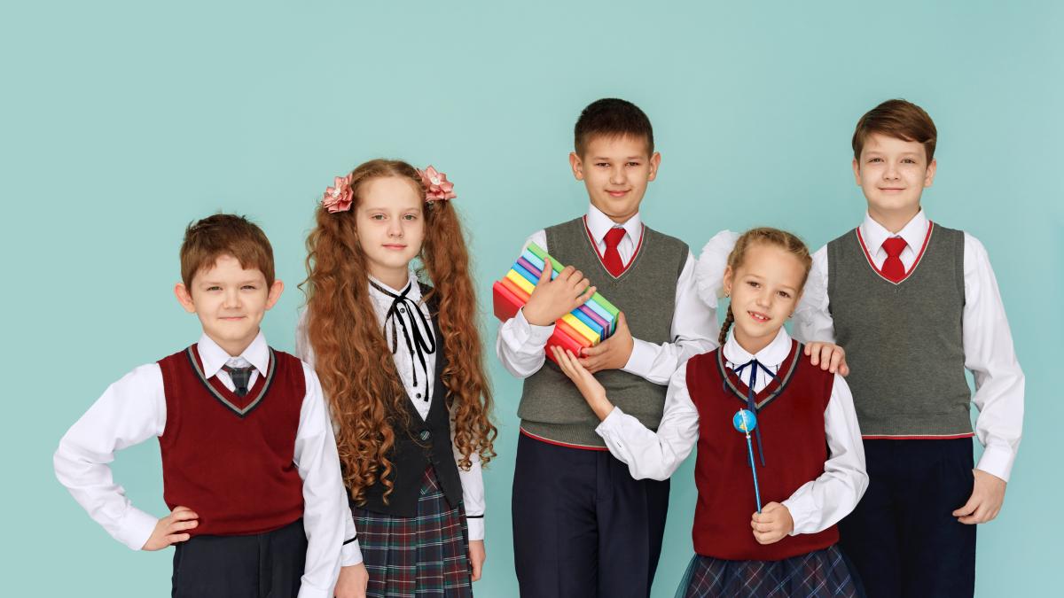 children-with-books-studio-blue-background_41688500
