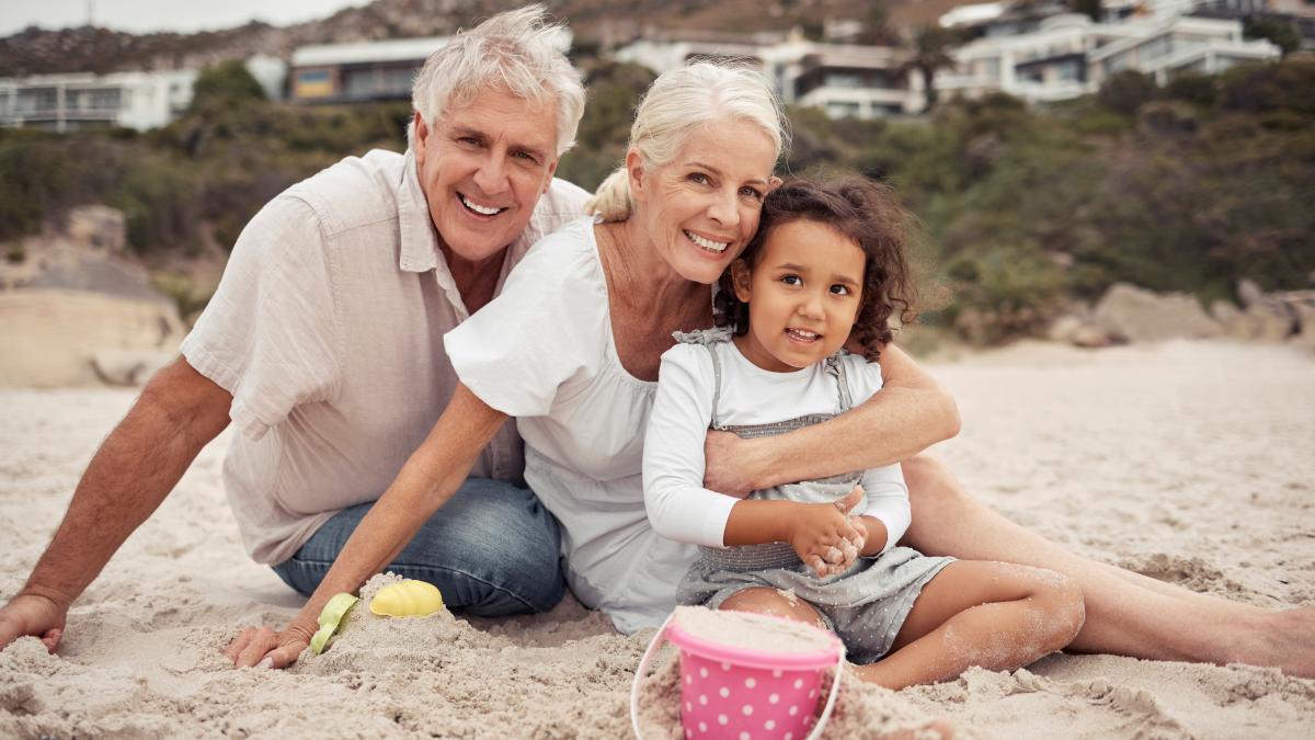 beach-family-love-with-girl-her-grandparents-beach-together-fun-bonding-holiday-travel-vacation-smile-with-happy-senior-couple-their-granddaughter-sand_24385000
