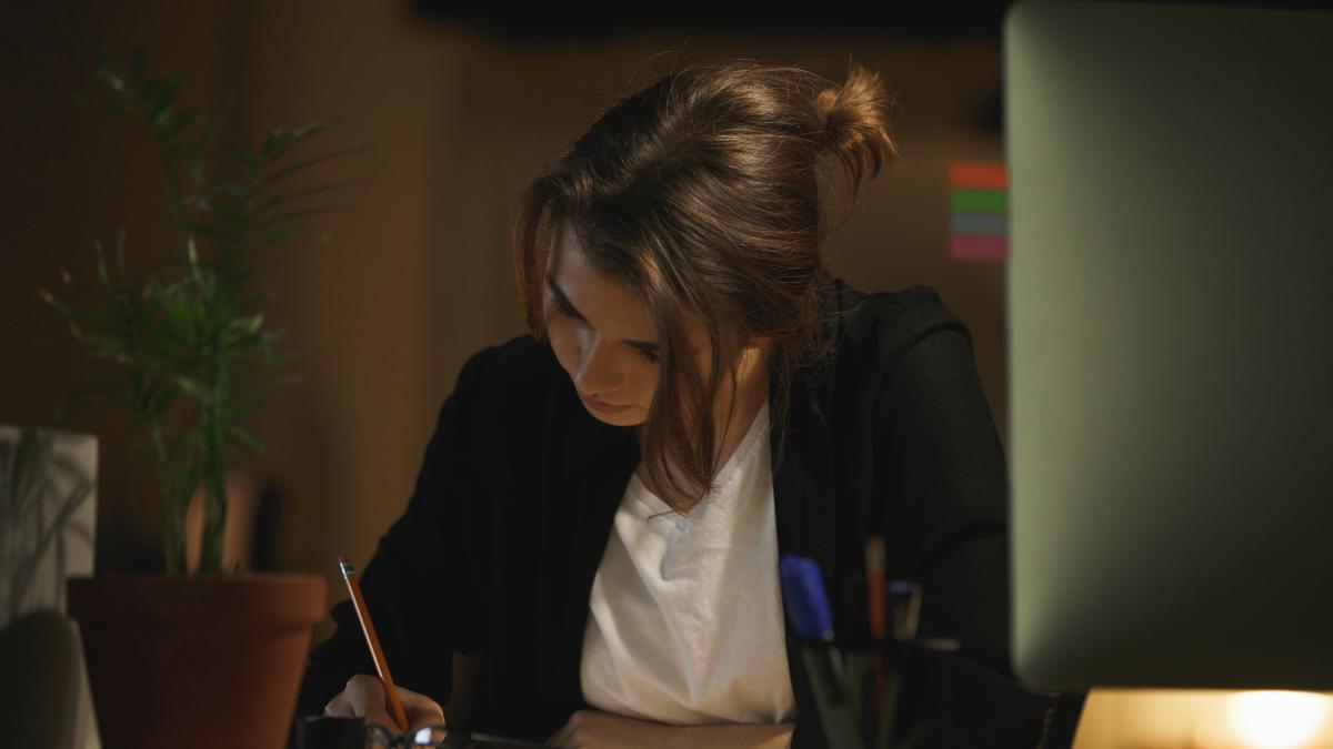 concentrated-young-lady-designer-sitting-office_30448900