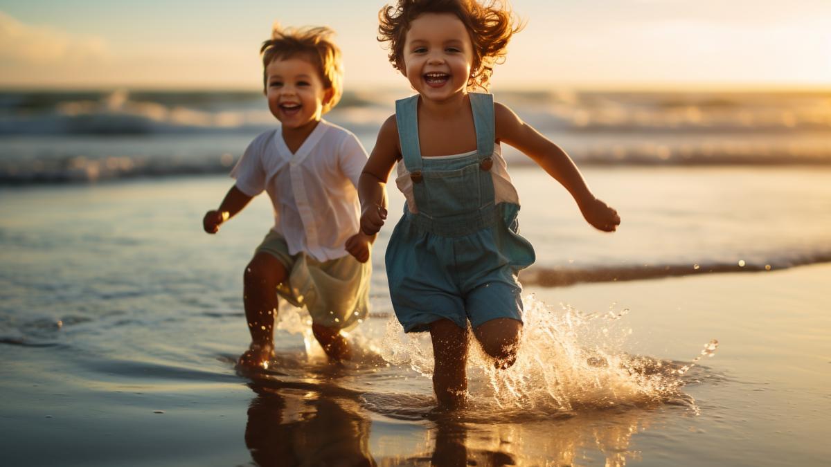 two-children-running-beach-one-them-is-wearing-white-shirt-other-is-wearing-white-shirt_24207100