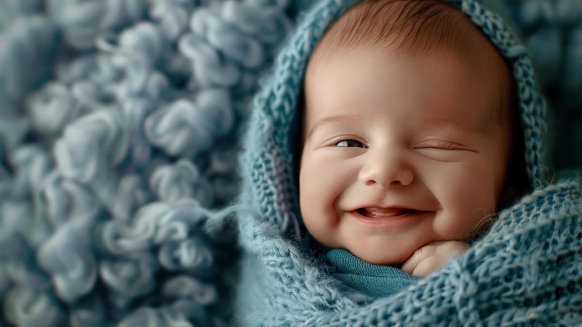 innocence-beauty-newborn-baby-wrapped-soft-blue-blanket_22995600