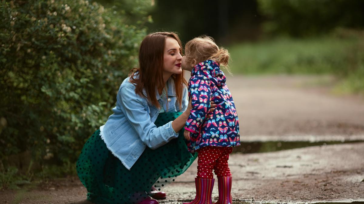 young-mom-little-daughter-have-fun-walking-gumboots-pools-park_59112800