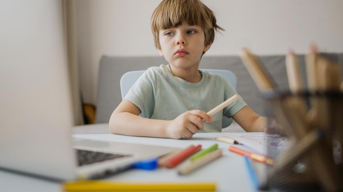 front-view-child-home-learning-form-laptop_49455800