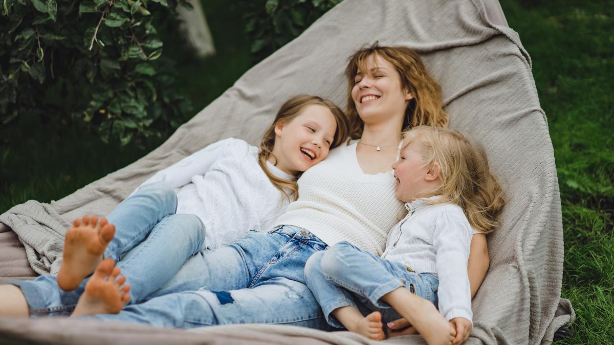 mother-with-children-having-fun-hammock-mom-kids-hammock_44237800