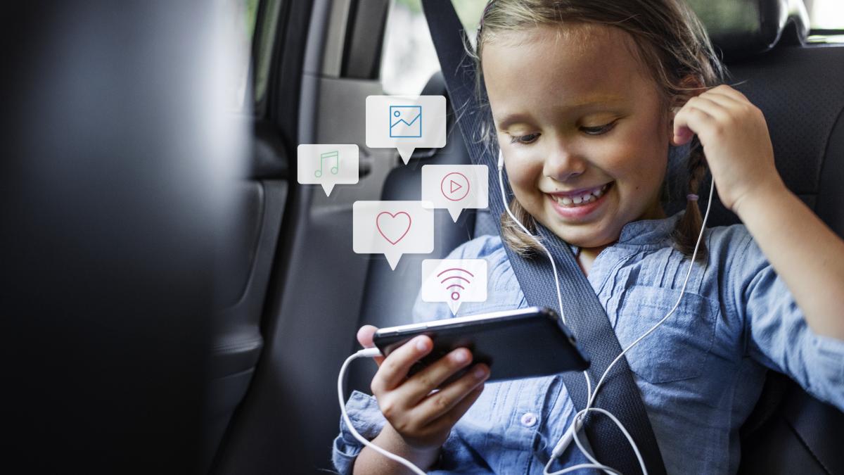 little-girl-using-phone-car_69983800