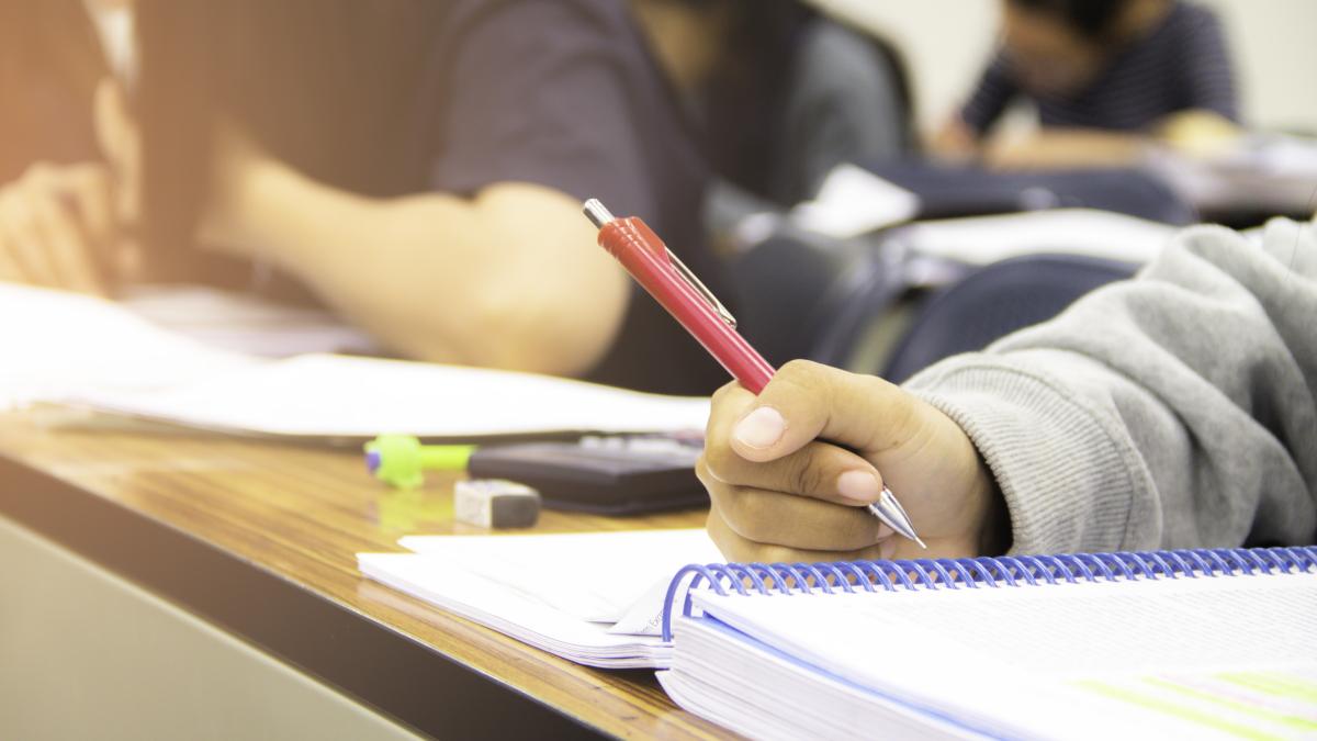 hands-university-student-study-quiz-test-exam-from-teacher-large-lecture-classroom-school_47747900