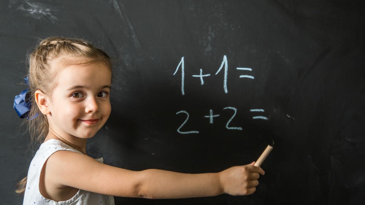 girl-schoolgirl-near-blackboard_91311800