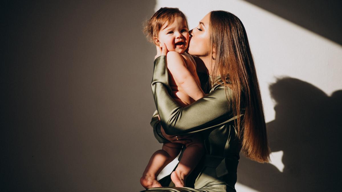 young-beautiful-mother-with-her-small-child-practicing-breast-feeding_61838500