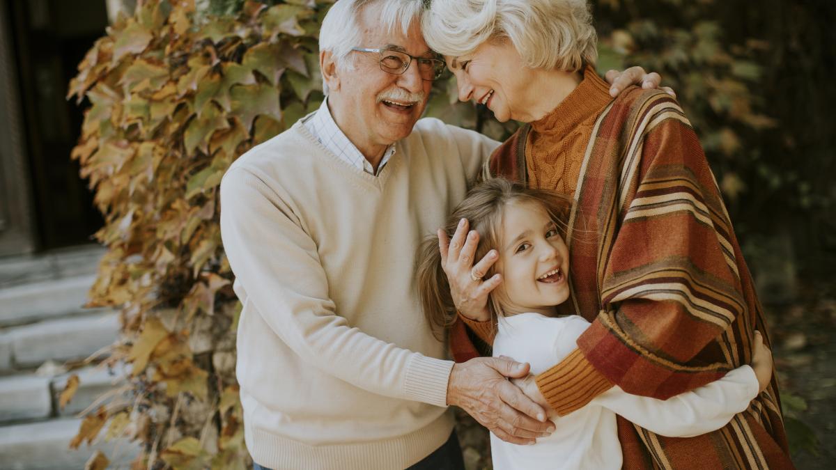 grandparents-enjoying-good-time-with-their-cute-little-granddaughter_91138900
